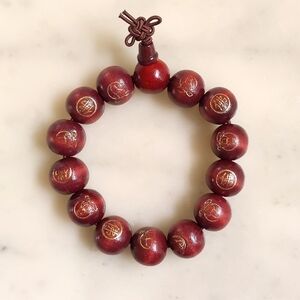 NWT. Handmade Wooden 14mm Beads w/Carved Buddha & Chinese Word Buddha Bracelet.